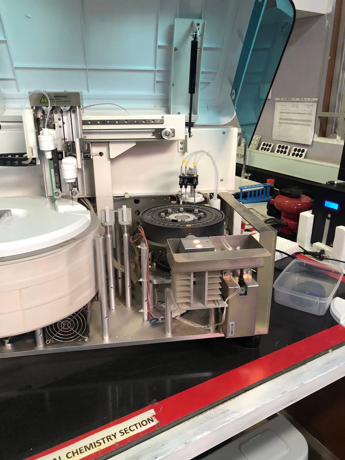 Open diagnostic analyzer being inspected during technical service